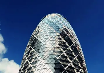Swiss Re Tower model against a blue backdrop